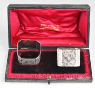 Victorian pair of hallmarked silver napkin rings with engraved butterfly and floral decoration,