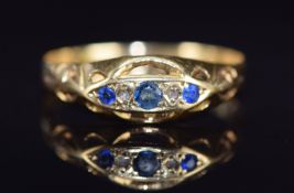 An 18ct gold ring set with sapphires and diamonds, Chester 1919,1.7g, size T