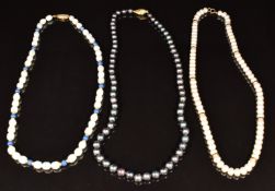 A grey pearl necklace with 18ct gold clasp, cultured pearl necklace with 9ct gold beads, and a