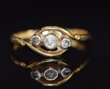 An 18ct gold ring set with diamonds in a platinum setting, 2.3g, size K/L