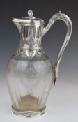 French late 19th or early 20thC silver mounted claret or similar jug with decoration of swans and