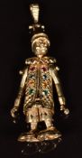 A 9ct gold pendant in the form of a jester set with paste, length 6cm, 10g