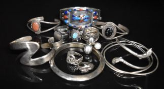 Six silver bangles including onyx, sunstone, etc and seven silver rings