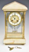 Alabaster and gilt metal four glass mantel clock with mercury compensated pendulum, striking on a