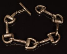 A silver bracelet made up of links in the form of horse stirrups, marked 800