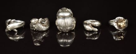 Five hallmarked silver rings in the form of a frog, duck, scarab beetle, dolphin and otter, maker