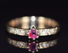 A 9ct gold ring set with a ruby and diamonds, 1.5g, size J