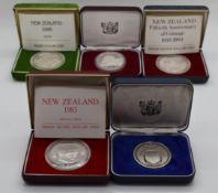 Five New Zealand silver dollars, some proof, all cased