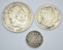 Three George III coins comprising 1820 crown, 1817 half crown and an 1805 Irish two pence bank