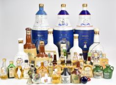 Nine bottles of Bell's presentation Scotch Whisky and approximately 25 whisky and other miniatures