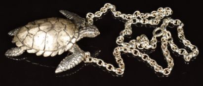 A hallmarked silver pendant in the form of a turtle, on silver chain, maker C G & S, 69g