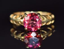 A 14k gold ring set with red topaz, 3.6g, size N