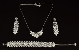 Swarovski suite of jewellery comprising bracelet, necklace, and earrings, in original box
