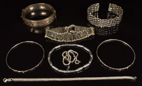 Four silver bangles and four silver bracelets