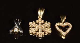 Three 14k gold pendants set with cubic zirconia, 7g