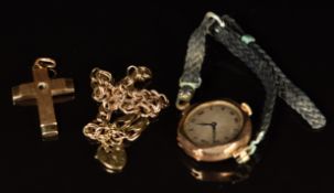 A 14k gold cross pendant (4.6g), 9ct gold bracelet (2.8g) and 9ct gold cased watch