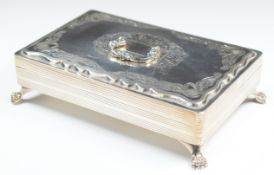 German or similar silver lidded box with handle to lid, raised on four lions paw feet, stamped