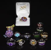 Thirteen silver rings set with amethyst, topaz, diopside, garnet, turquoise, etc
