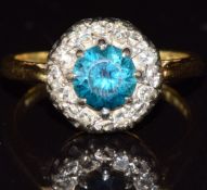 An 18ct gold ring set with a zircon surrounded by diamonds, 4.0g, size J
