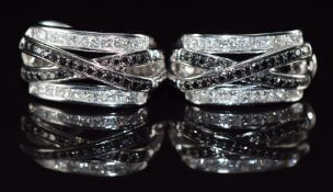 A pair of Hammer & Sohne 18ct white gold earrings each set with eleven white princess cut diamonds