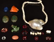 Two carved agate scarab beetles, carved jadeite charm in the form of a squirel, agate intaglio,