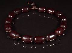 A cherry amber necklace made up of 17 barrel shaped beads, each 19 x 26mm, 120g