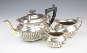 Victorian hallmarked silver three piece teaset with ribbed lower body and gadrooned edge, raised