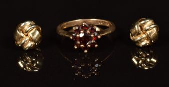 A 9ct gold ring set with a cluster of garnets and a pair of 9ct gold knot earrings, 2.8g