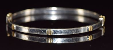 A 14k gold bi-coloured bangle, 8.2g