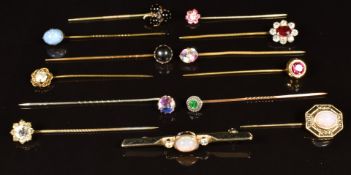 Eleven Victorian stick pins set with paste