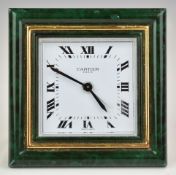 Cartier Paris travel alarm clock with malachite style frame, on gilt easel back, the adjustment