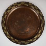 Hugh Wallis (1871- 1943) Arts & Crafts hammered copper charger, with pewter inlaid geometric rim and