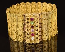 Victorian pinchbeck bracelet set with a ruby, emerald, garnet, amethyst, ruby and diamond reading '