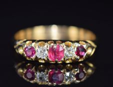 A c1910 18ct gold ring set with rubies and diamonds, 3.8g, size T
