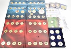 A collection of various Danbury Mint decorative coin sets to include Famous Ships of the World,