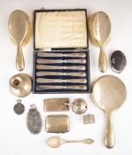 Hallmarked silver items to include candlestick, hand mirror, brushes, card case, silver handled