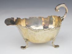 Edward VII hallmarked silver sauce boat raised on three feet, Chester 1906, maker George Nathan &