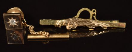A 9ct gold pin set with a diamond of approximately 0.18ct in a star setting (4.9g) and a 9ct gold