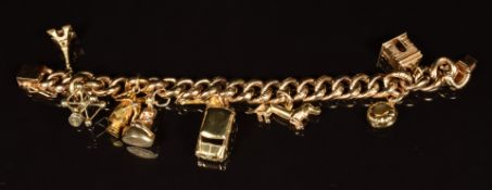 A gold plated charm bracelet set with a silver charm and gold plated charms