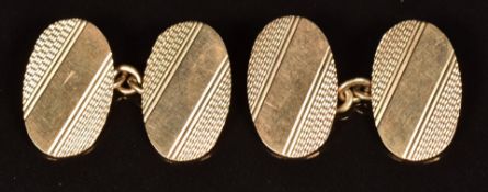 A pair of 9ct gold oval cufflinks with engine turned decoration, 5.2g
