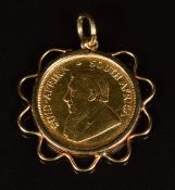 A 9ct gold pendant set with a 1985 1/10 gold Krugerrand, 4.1g