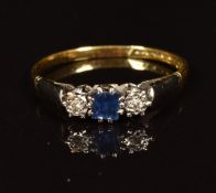 An 18ct gold ring set with a square sapphire and diamonds, 1.9g,