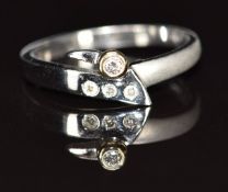 A 14k white gold ring set with four diamonds, 2.4g, size L/M