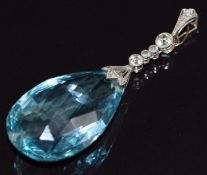Art Deco platinum pendant set with a briolette cut aquamarine and old cut diamonds, the largest