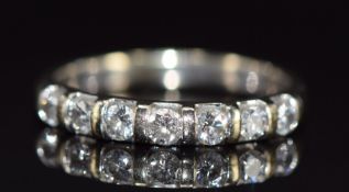 An 18k white gold half eternity ring set with seven diamonds, each approximately 0.07ct, 2.5g,