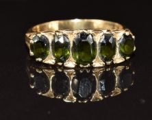 A 9ct gold ring set with five oval cut tourmaline, 4.7g, size S