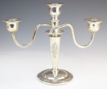 Thai silver three branch candelabra with embossed decoration of a deity to front and back, marked to