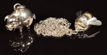 Two hallmarked silver pendants, one in the form of a bee the other a pig, 28g
