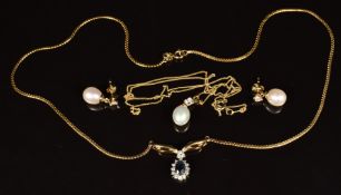 A 9ct gold pendant set with a pearl and cubic zirconia, with matching earrings and a 9ct gold