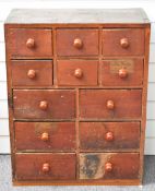 Victorian stained pine haberdashery chest of 12 drawers containing pocket watches, tools, watch